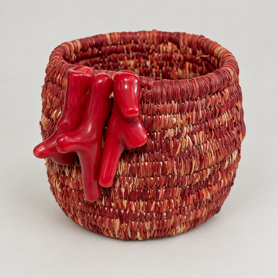 Hand woven raffia vessel with coral detail