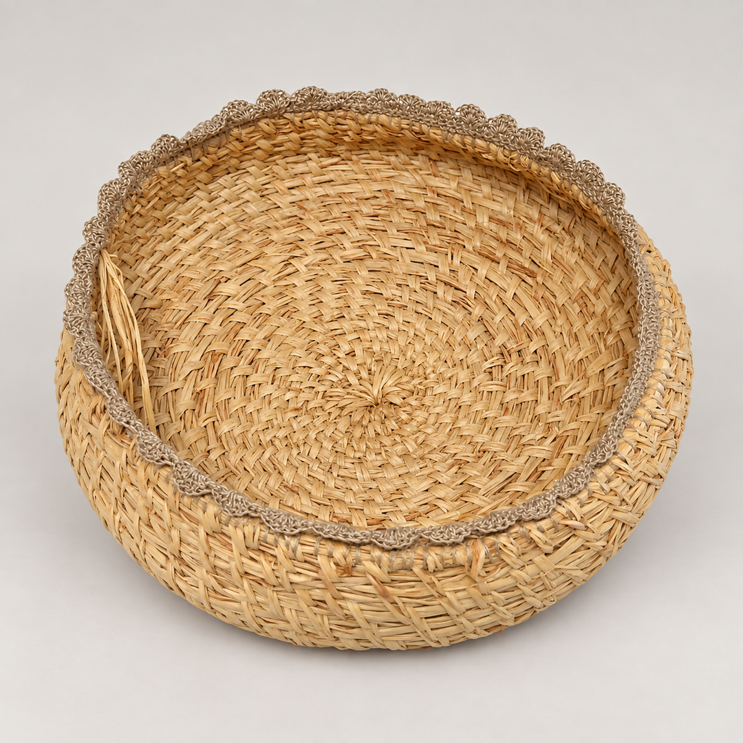 Hand woven raffia vessel with linen lace trim
