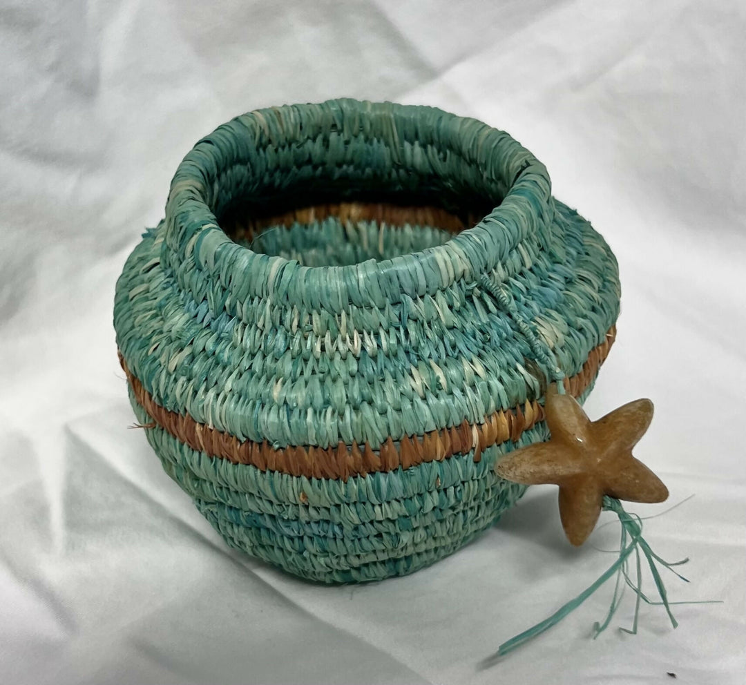 Hand woven raffia vessel